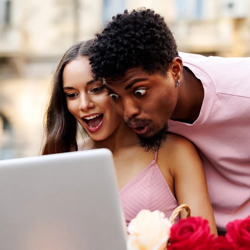 A couple celebrating the discovery of their ideal franchise opportunity, illustrating the success of the matchmaking process.
