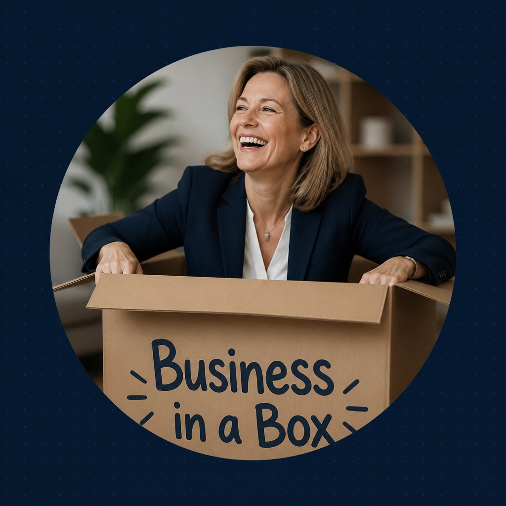 A professional woman laughing joyfully inside a giant box labeled 