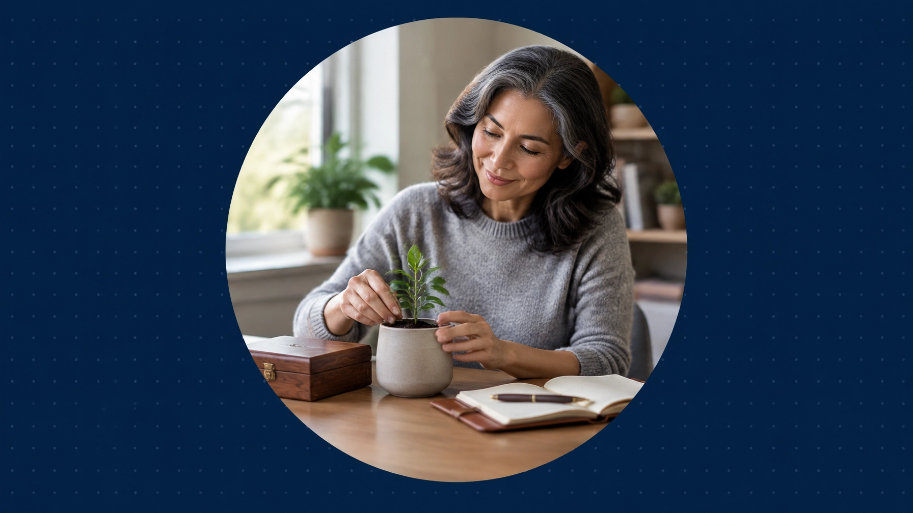 A woman plants a small seedling beside a keepsake box and an open journal